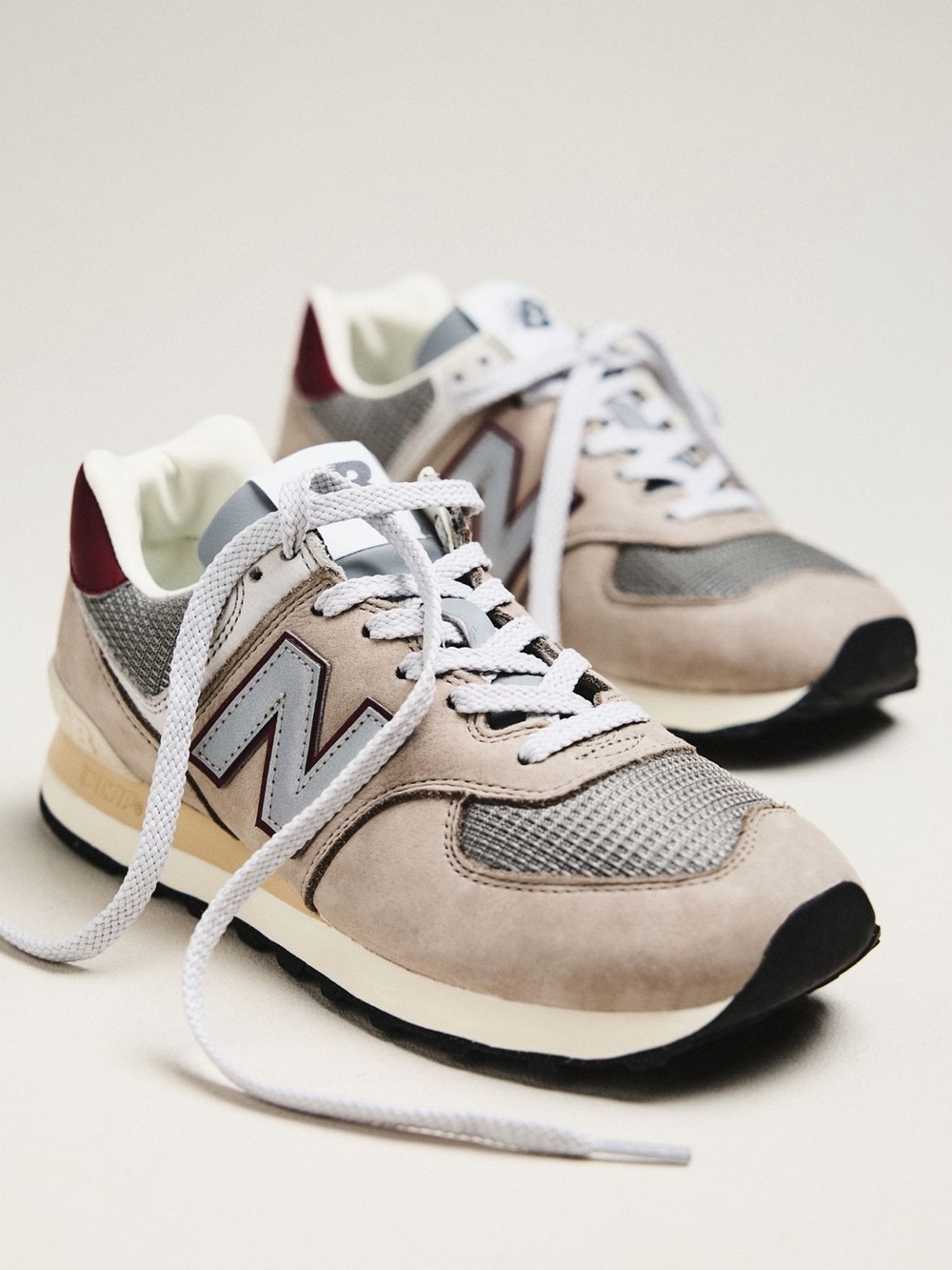 New Balance sneakers in beige, gray and burgundy